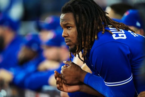 Blue Jays first baseman Vladimir Guerrero Jr. looks on from the dugout as they face the Seattle Mariners during ninth inning on Saturday, Oct. 8, 2022. 