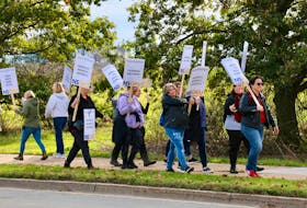 Passing motorists honked their horns in support of striking educational support workers in Windsor Oct. 24.
