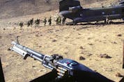 This March 17, 2002, file photo shows the Princess Patricia’s Canadian Light Infantry Battalion preparing to get on a Chinook helicopter in the Shahi Kot Valley region of eastern Afghanistan.
