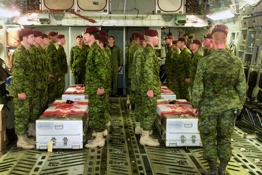  Members of the Princess Patricia’s Canadian Light Infantry pay their last respects aboard a United States Air Force C 17 aircraft to four of their fallen comrades who were killed in a training accident near Kandahar, Afghanistan in April 2002.