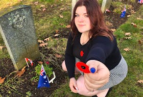 Paige Lundy, a Grade 10 student at Middleton Regional High School, laid poppies for Sgt. Donald Gillespie and F/Sgt. pilot Reg Bellhouse during the No Stone Left Alone service Nov. 4 at the Commonwealth War Graves at Old Holy Trinity Cemetery in Middleton.
Jason Malloy