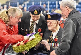 104-year-old Second World War veteran James 'Jim' McRae, a recipient of the Distinguished Flying Cross, receives some assistance while laying a wreath during the Yarmouth Legion Branch 61 Remembrance Day ceremony at the Yarmouth Mariners Centre. McRae turns 105 later in November. Those in attendance at the ceremony sang Happy Birthday to him. TINA COMEAU PHOTO