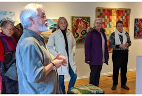 Annapolis Royal Community Arts Council board member Ted Lind speaks to a crowd at the Artsplace Gallery. The Artsplace is celebrating its 40th anniversary with three new exhibits on Nov. 12. Contributed