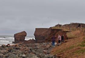 Visitors to the Prince Edward Island National Park explore the changes to the sea arch at MacKenzies Brook on Nov. 13.  Alison Jenkins • The Guardian