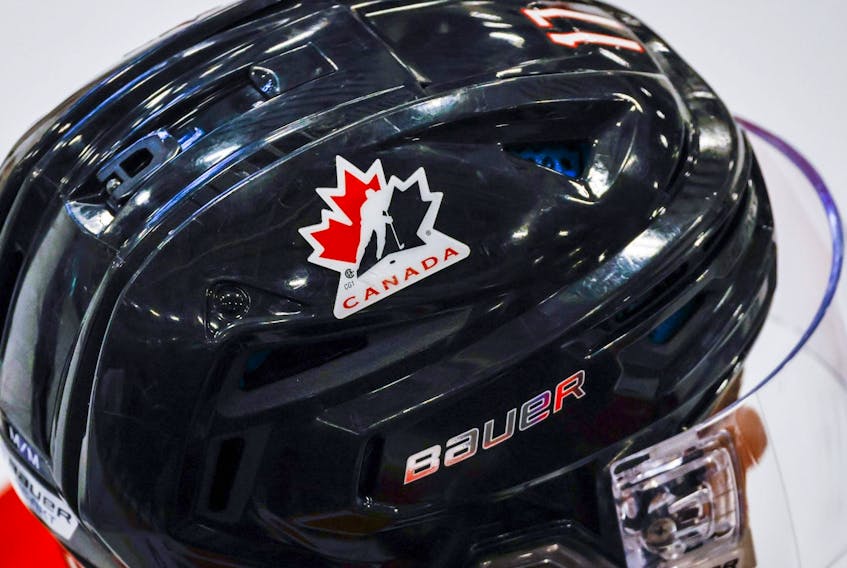 A Hockey Canada logo is visible on the helmet of a national junior team player during a training camp practice in Calgary, Tuesday, Aug. 2, 2022.  