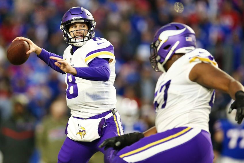 Kirk Cousins of the Minnesota Vikings attempts a pass during overtime against the Buffalo Bills at Highmark Stadium on November 13, 2022 in Orchard Park, New York.  
