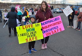 Kathleen Cousins, a resident care worker with the Breton Ability Centre, brings her six-year-old son Jordan to support his mother during a CUPE 3513 information picket in Sydney River on Tuesday morning. IAN NATHANSON/CAPE BRETON POST