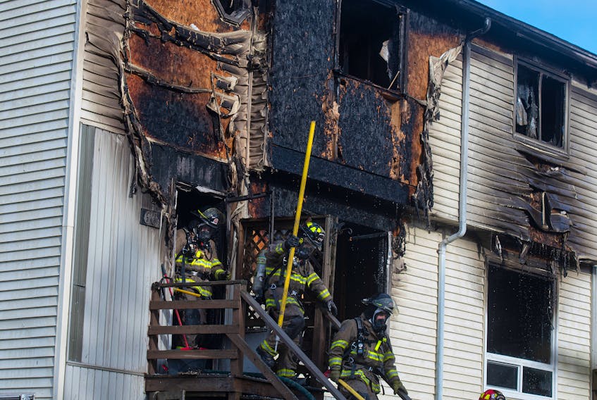 Firefighters step outside from a duplex on McKay Lane in Eastern Passage on Tuesday, Nov. 15, 2022. The duplex was severely damaged in the blaze which was called in around 7:45 a.m.
Ryan Taplin - The Chronicle Herald