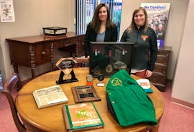 Jane Arnold and Teena Campbell are shown in the Beaton Institute with some prized artifacts for the CBU Hall of Fame. CONTRIBUTED