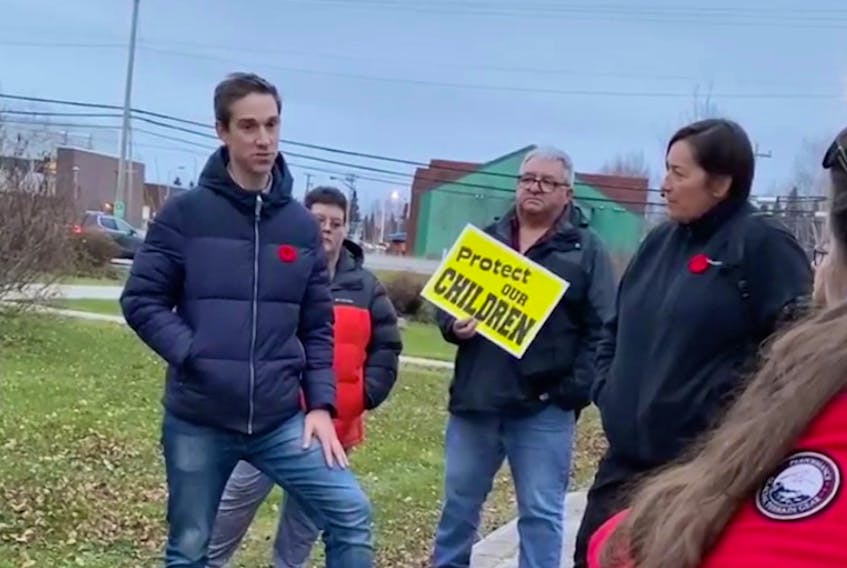 Justice Minister John Hogan talks to Happy Valley-Goose Bay residents Nov. 10 in this screenshot from a video. Looking on at right is RCMP Assistant Commissioner Jennifer Ebert. (Contributed)