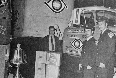 The Windsor Fire Department shipped out 5,000 booklets on the station’s history to the International Fire Chiefs Convention in Maryland in 1972. United Van Lines and Boyd’s Transfer Ltd. partnered with the fire department, delivering the booklets for free. Pictured, from left, are Grant Boyd, Jim Frenette, and Roscoe Schofield.
