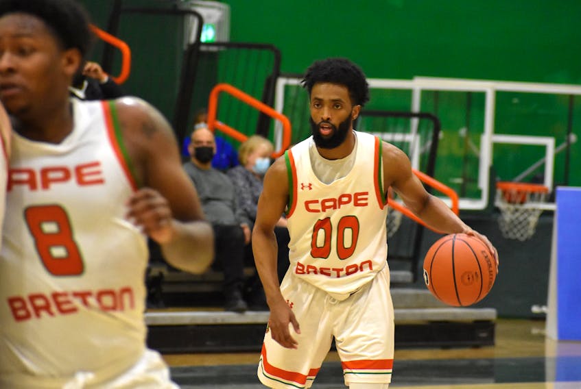 Cape Breton Capers guard Osman Omar, right, broke the men’s basketball program’s all-time scoring record when he recorded 42 points in the Capers’ win over Acadia on Saturday in Wolfville. The previous Cape Breton University record was set by current athletic director John Ryan nearly 30 years ago. JEREMY FRASER/CAPE BRETON POST