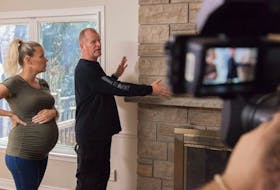 Mike Holmes and Sherry discuss a homeowner’s wood-burning fireplace from Holmes and Holmes, Season 2. 