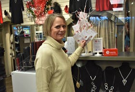 Elegant Steps owner Karen Baillie stands beside the 'Giving Tree' in her Inglis Place store.