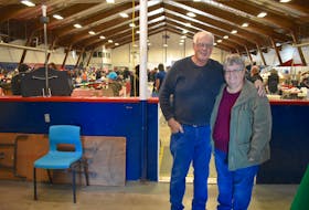 George Peters, owner of Bargain Hunters Flea Market, stands with longtime employee Peggy Johnson inside the Centennial Arena in Sydney in 2019. CAPE BRETON POST FILE