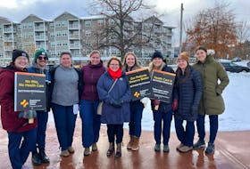 RNUNL president Yvette Coffey, centre, is pictured with nurses who took part in a rally calling for action to stabilize nursing and protect patient care in Corner Brook on Nov. 15. – Image from the RNUNL Facebook Page