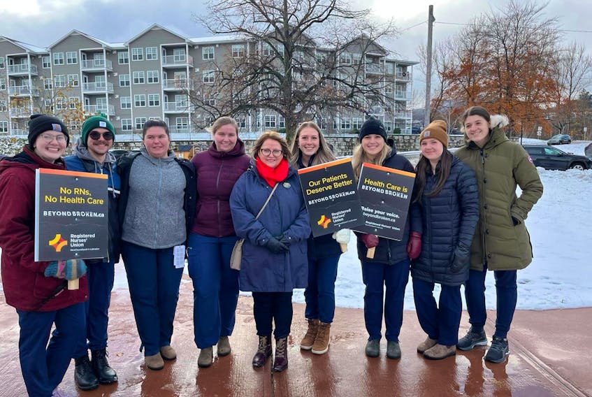 RNUNL president Yvette Coffey, centre, is pictured with nurses who took part in a rally calling for action to stabilize nursing and protect patient care in Corner Brook on Nov. 15. – Image from the RNUNL Facebook Page