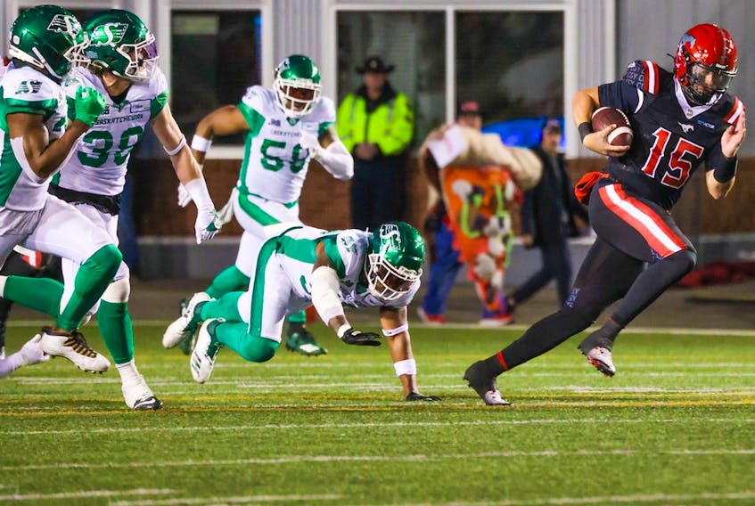  Calgary Stampeders quarterback Tommy Stevens outruns Saskatchewan Roughriders defenders during CFL action at McMahon Stadium on Saturday, October 29, 2022.