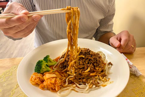 All of the noodles at Noodles Express are freshly made to order, like these, served with Minced Pork Saozi. Gabby Peyton photo