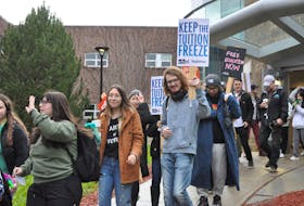 Students with signs calling for a freeze on tuition, or better yet, free education leave Grenfell Campus in Corner Brook on Wednesday (Nov. 2) and march to the Sir Richard Squires Building. - Diane Crocker/SaltWire Network