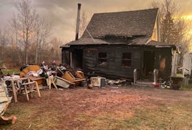 The charred remains of the home of Lorne (Cricket) Gillis and Ruth Cornish of Portage are pictured following a fire the destroyed the home and barns on Nov. 19. Contributed