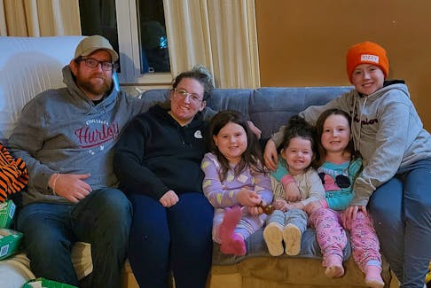 Jonathan White and Megan Aylward pose for a family photo with their children Brielle, Blakely, Braelyn and Bentley. In October, Blakely, fourth from left, was struck by a car outside her Borden-Carleton home. After spending more than a month in the hospital in Halifax, Blakely is back home with her family and still has a long recovery ahead of her. – Contributed