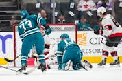  Noah Gregor #73 of the San Jose Sharks scores a goal getting his shot past Cam Talbot #33 of the Ottawa Senators during the first period of an NHL hockey game at SAP Center on November 21, 2022 in San Jose, California.