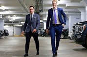  Bo Horvat and Tyler Myers of the Vancouver Canucks walk to the Canucks dressing room before their NHL game against the Vegas Golden Knights at Rogers Arena Nov. 21, 2022.