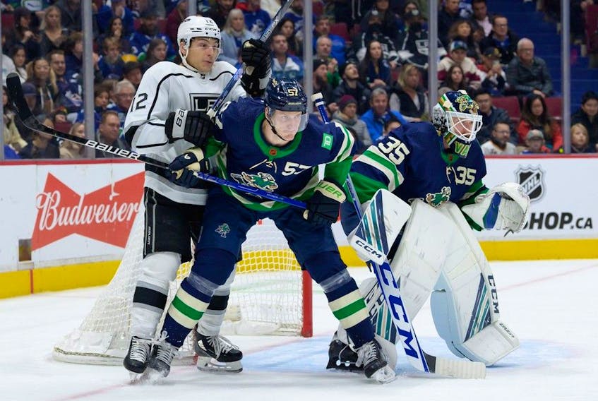 Thatcher Demko and Tyler Myers of the Vancouver Canucks defend against Trevor Moore of the Los Angeles Kings during the second period of their NHL game at Rogers Arena on Nov. 18, 2022. Vancouver won 4-1.