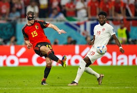 Belgium's Thomas Meunier in action with Canada's Alphonso Davies in their World Cup match Wednesday, Nov. 23, 2022 at Ahmad Bin Ali Stadium, Al Rayyan, Qatar. - John Sibley / Reuters