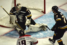 Oliver Satny of the Cape Breton Eagles, middle, makes a save during Quebec Major Junior Hockey League action against the Rouyn-Noranda Huskies at Centre 200 last month. Satny has used a trade from Charlottetown to Cape Breton as motivation to be better between the pipes for the Eagles. JEREMY FRASER/CAPE BRETON POST