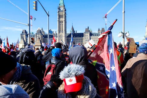 A Confederate flag is seen during the Freedom Convoy protest in Ottawa on January 29, 2022. A lawyer for the protest organizers wants executives from public affairs firm Enterprise Canada to testify at the Public Order Emergency Commission about the sighting of a Nazi and a Confederate flag during the protest.