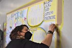 Artist Julia Feltham worked on a mural during the summit which was located in the Hurricane Room at the Debert Hospitality Centre. Richard MacKenzie