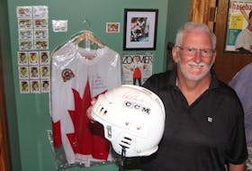 New Minas resident Jim Prime holds a helmet signed by Paul Henderson. He co-authored a book, How Hockey Explains Canada, with the hero of the 1972 Summit Series.
Jason Malloy