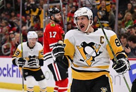 Sidney Crosby of the Pittsburgh Penguins celebrates after scoring a goal in the third period against the Chicago Blackhawks on November 20, 2022 at United Center in Chicago, Illinois. Pittsburgh defeated Chicago 5-3.  
