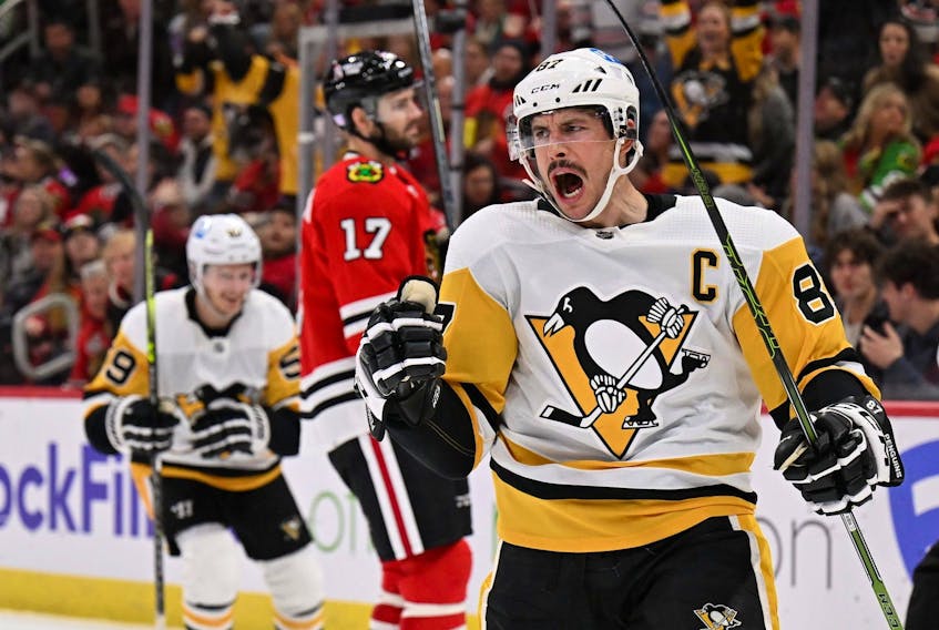 Sidney Crosby of the Pittsburgh Penguins celebrates after scoring a goal in the third period against the Chicago Blackhawks on November 20, 2022 at United Center in Chicago, Illinois. Pittsburgh defeated Chicago 5-3.  
