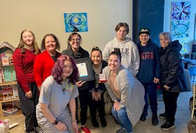 YMCA staff and volunteers surprised some people at J-Street Community Youth Space on Nov. 18 to present them with the YMCA Peace Medal. From left are Victoria Braden, YMCA CEO Sabrina Vatcher, Saralyn Gillan, Cailyn Gillan, Kassandra Osmond, Hayden Timbury, Micayla Buis, Breton McGean and Alice Gillan. CONTRIBUTED/YMCA OF CAPE BRETON