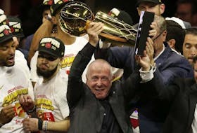 Raptors part-owner Larry Tanenbaum holds up the Larry OBrien Trophy after Toronto beat the Golden State Warriors in the NBA Finals.