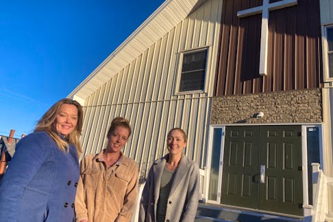 Cumberland North MLA Elizabeth Smith-McCrossin, housing support worker Monica Gibbons and organizing team member Hannah Landry outside the Crossroads Community Church, which will be converted into a temporary winter homeless shelter.