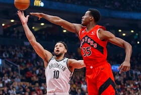 Ben Simmons of the Brooklyn Nets drives to the net against Christian Koloko of the Raptors during the first half at Scotiabank Arena on Wednesday, Nov. 23, 2022 in Toronto. 