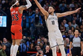 Gary Trent Jr. #33 of the Toronto Raptors puts up a shot over Ben Simmons #10 of the Brooklyn Nets. 