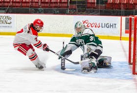 UPEI goalie Sarah Forsythe denies UNB’s Lily George on a scoring attempt during the Panthers 3-0 win Nov. 23 in Fredericton. James West for UNB Athletics • Special to The Guardian