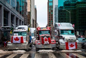 Trucks block a street in Ottawa on Feb. 6.