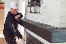 Mike Holmes on location for Holmes and Holmes, where he updated a wood-burning fireplace with a gas insert. 