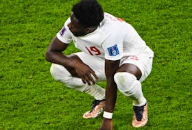 Canada's Alphonso Davies reacts after the World Cup Group F football match against Belgium.