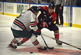 Ivan Ivan of the Cape Breton Eagles, right, works his way around Brady Schultz of the Halifax Mooseheads during Quebec Major Junior Hockey League action at Centre 200 on Friday. Halifax won the game 6-2. JEREMY FRASER/CAPE BRETON POST.