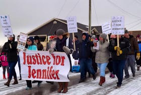 In this file photo, people march through Husky Drive where Jennifer Hillier Penney went missing on Nov. 30, 2016, to demand justice for the missing woman. - Contributed
