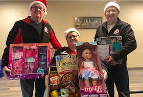 Since September, Ray McCourt, left, Sue Gallant and Eric Ferrish, have been busy preparing for the Kin Family's annual Christmas Appeal. The appeal, an event to raise money for the organization's Christmas hampers, will air on Eastlink TV channel 10 on Monday, Dec. 5.
