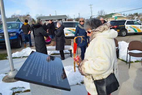 Shirley Christmas looks over the monument at the centre of the Red Dress Park outside of the police station in Membertou on Friday. The park honours and remembers missing and murdered Indigenous people. GREG MCNEIL/CAPE BRETON POST