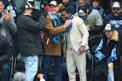  Toronto Argonauts GM Michael (Pinball) Clemons is hugged by team president Bill Manning as the Argos take the main stage at Maple Leaf Square for a victory rally to celebrate their Grey Cup championship, on Thursday, Nov. 24, 2022. JACK BOLAND/TORONTO SUN